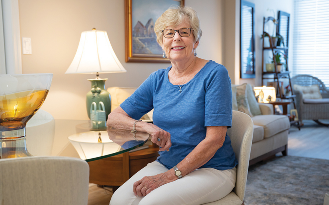 Joanne Judy, "JJ," sits in her well-appointed home at the Mayflower at Winter Park